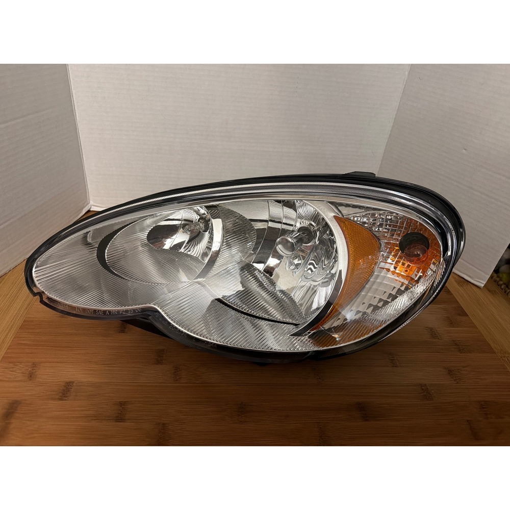 TYC 20-6774-00-1 Compatible‎ with Chrysler PT Cruiser Left Replacement Head Lamp